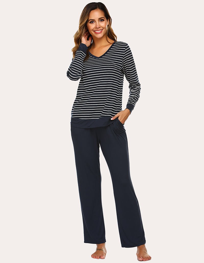 Navy striped long-sleeve pajama top with solid navy pants, side view