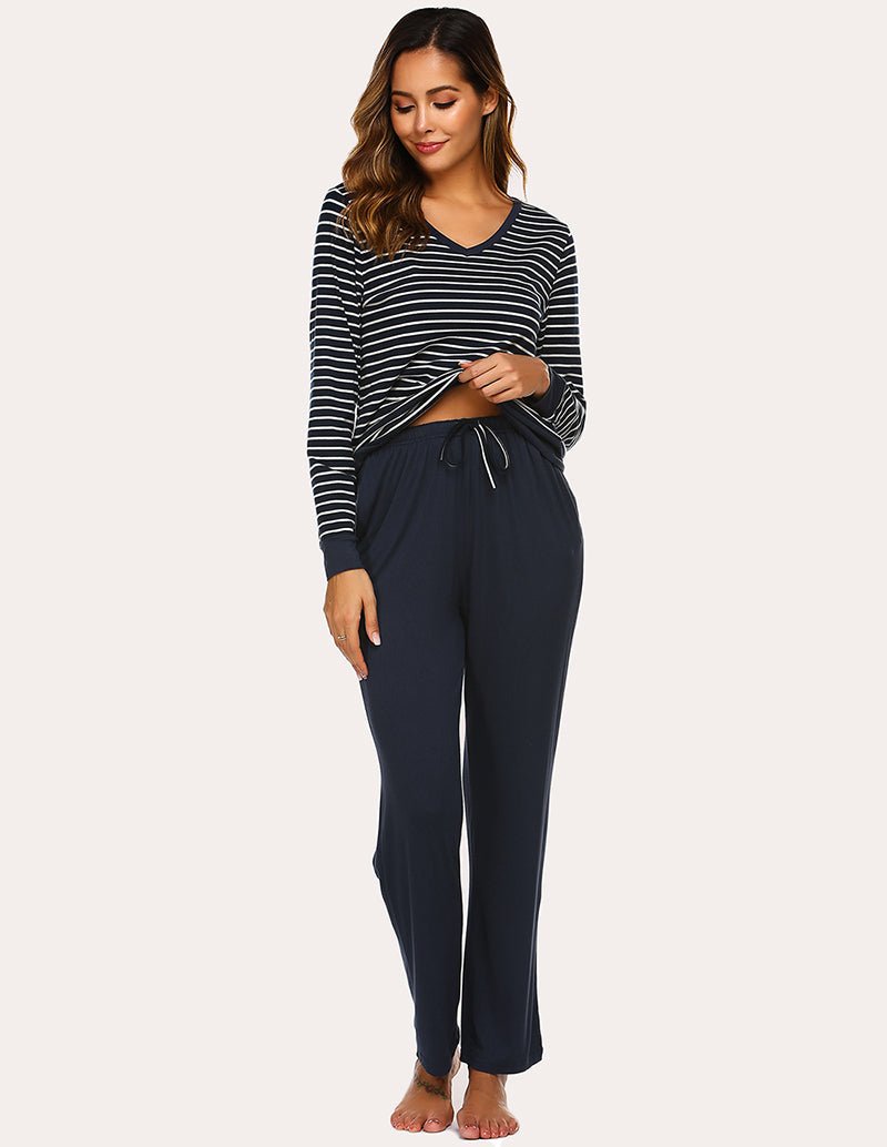 Striped long-sleeve pajama top with solid navy drawstring pants, front view