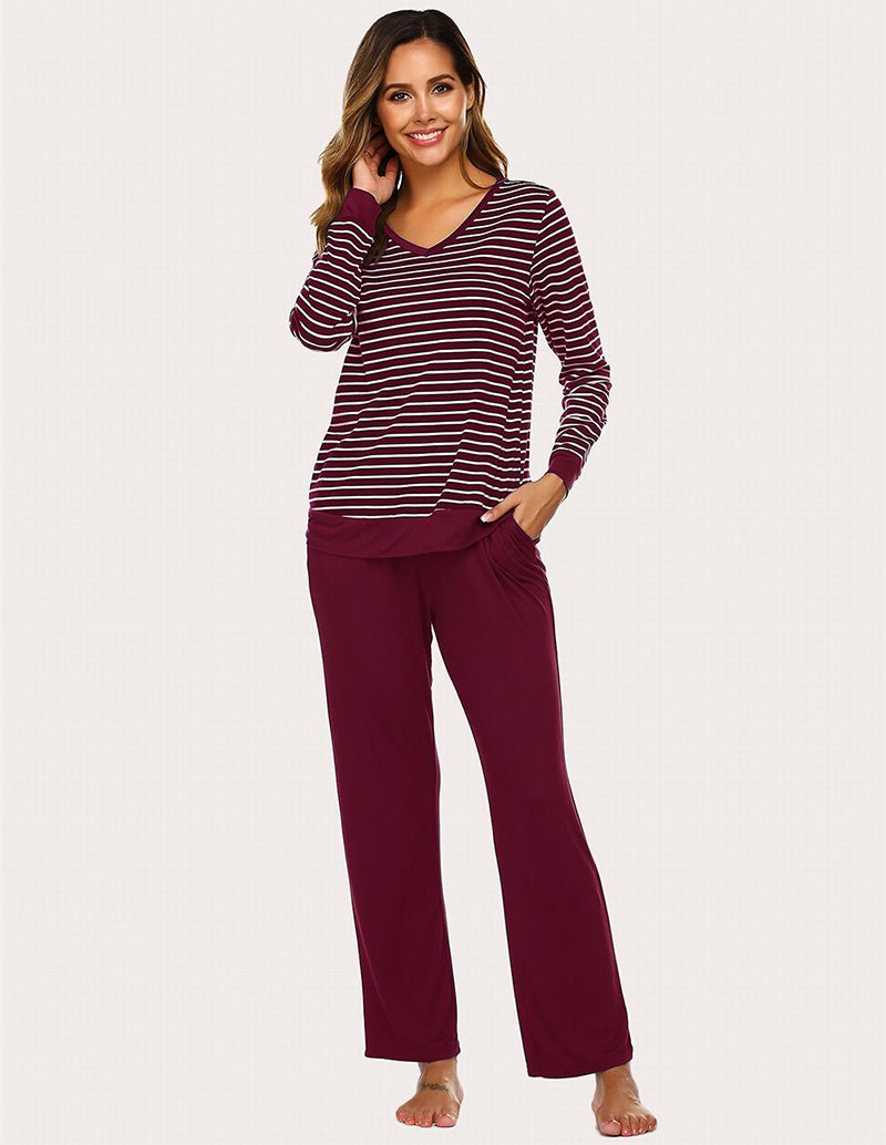 Wine red striped long-sleeve pajama top with solid wine pants, side view