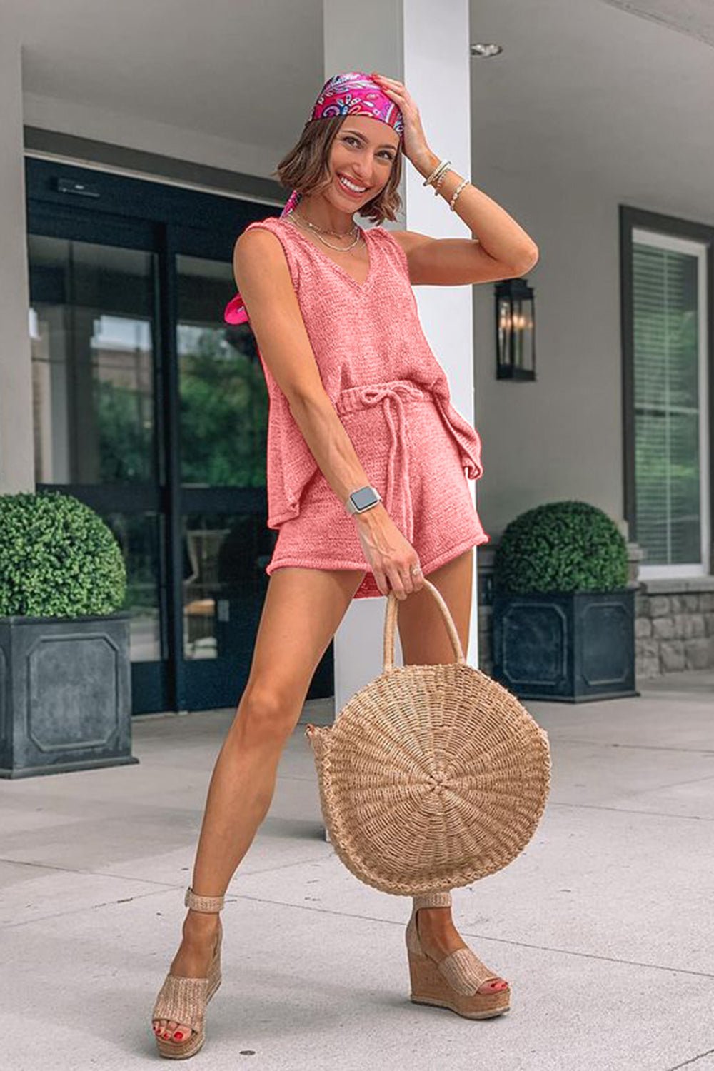 Pink sleeveless knit pajama set with V-neck top and drawstring shorts