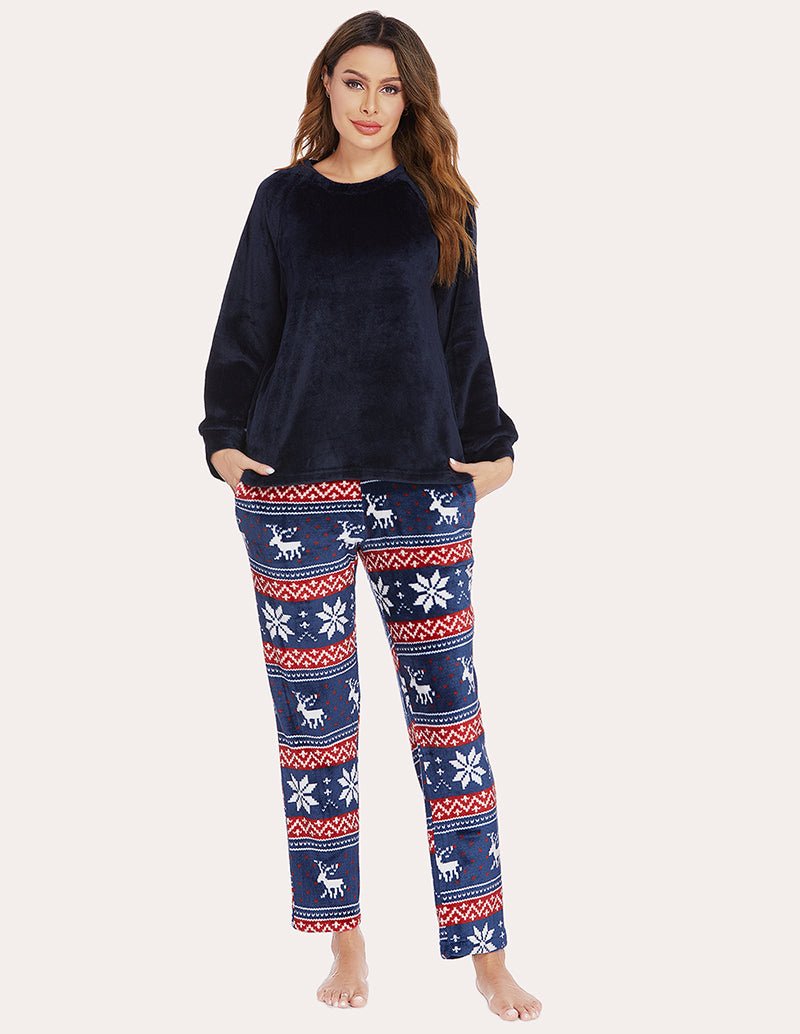 Women's fleece pajama set, navy top with festive reindeer patterned pants