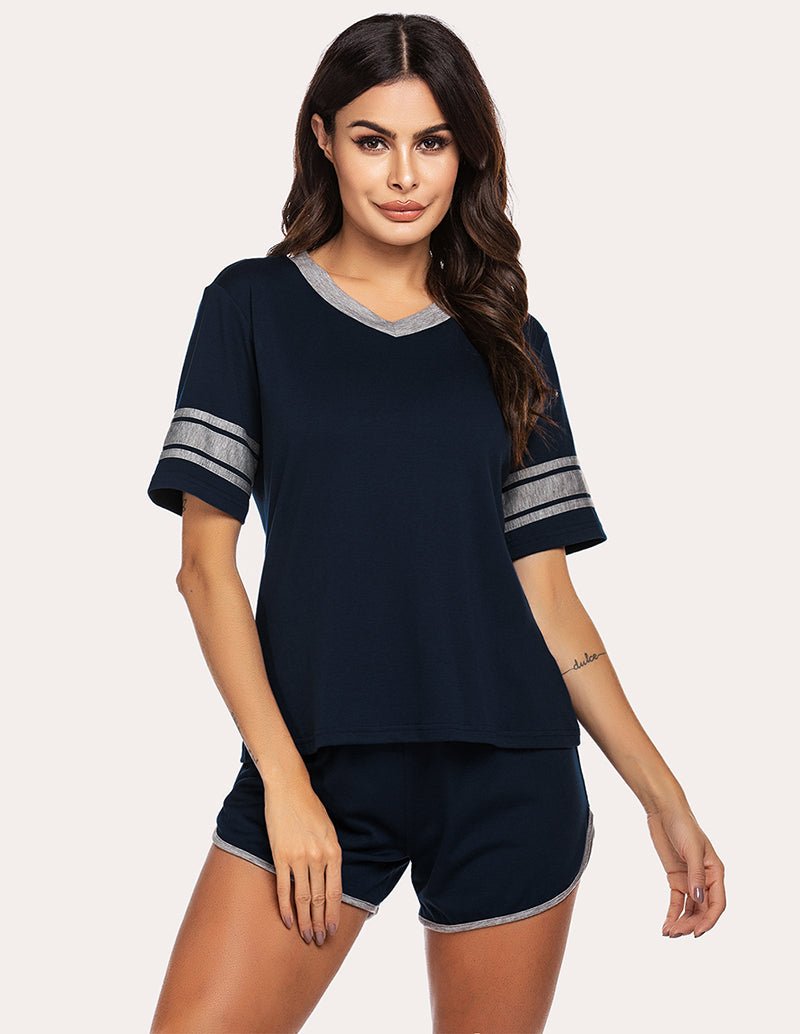 Dark navy sweet pajama set with V-neck top and striped sleeve cuffs, matching shorts