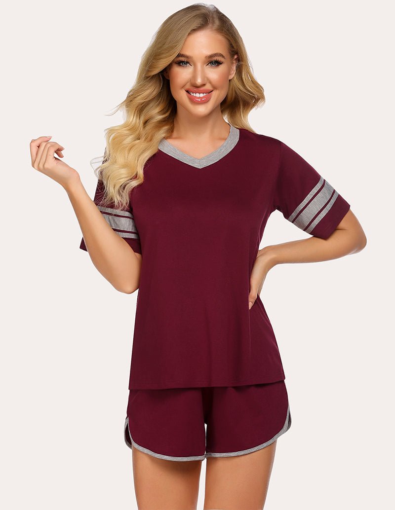 Wine red pajama set with short-sleeve V-neck top and matching shorts, striped trim