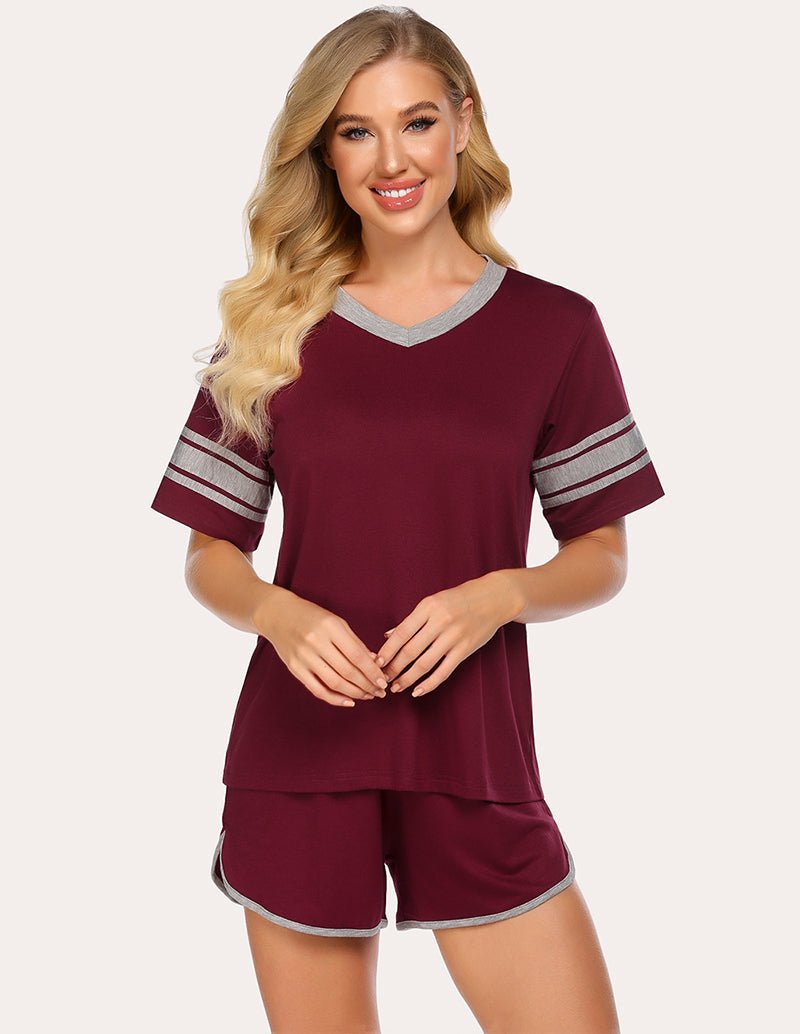 Wine red pajama set with short-sleeve top and matching shorts, striped neckline and cuffs