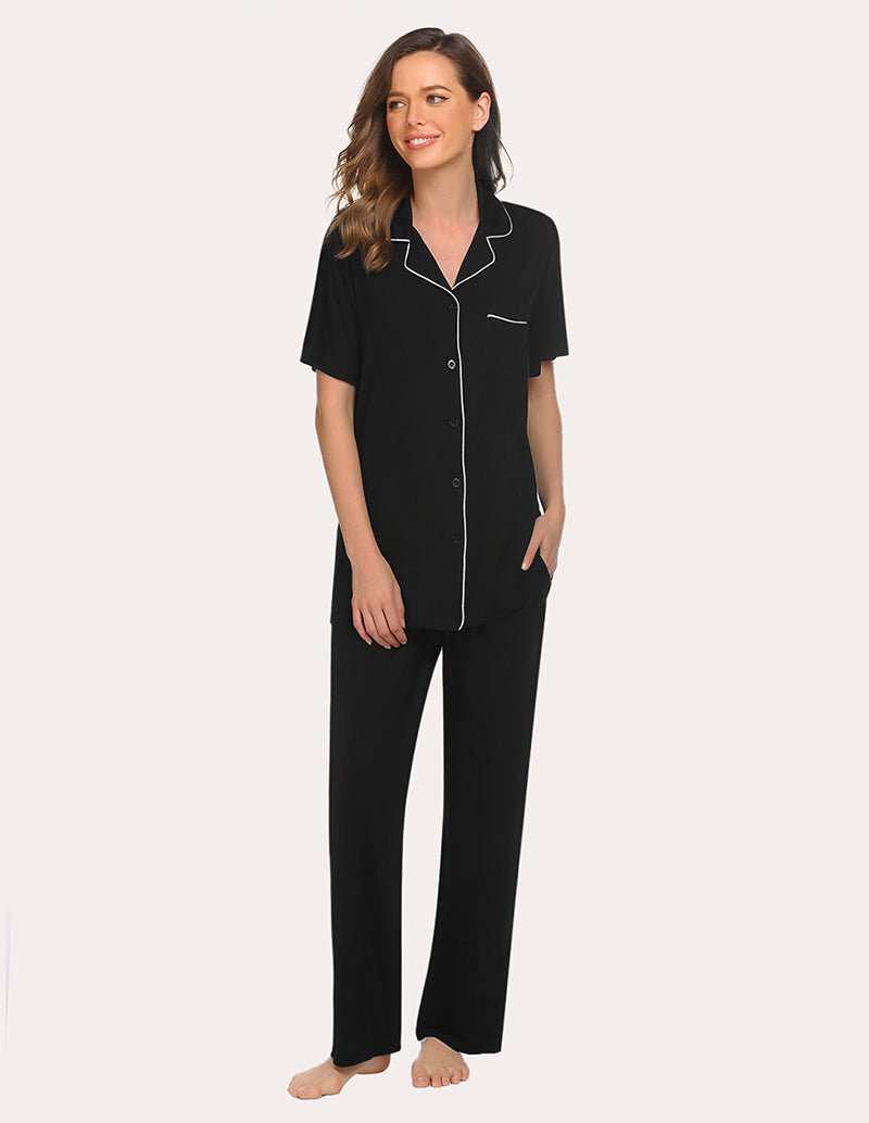 Black short-sleeve button-front pajama set with contrast piping, matching pants