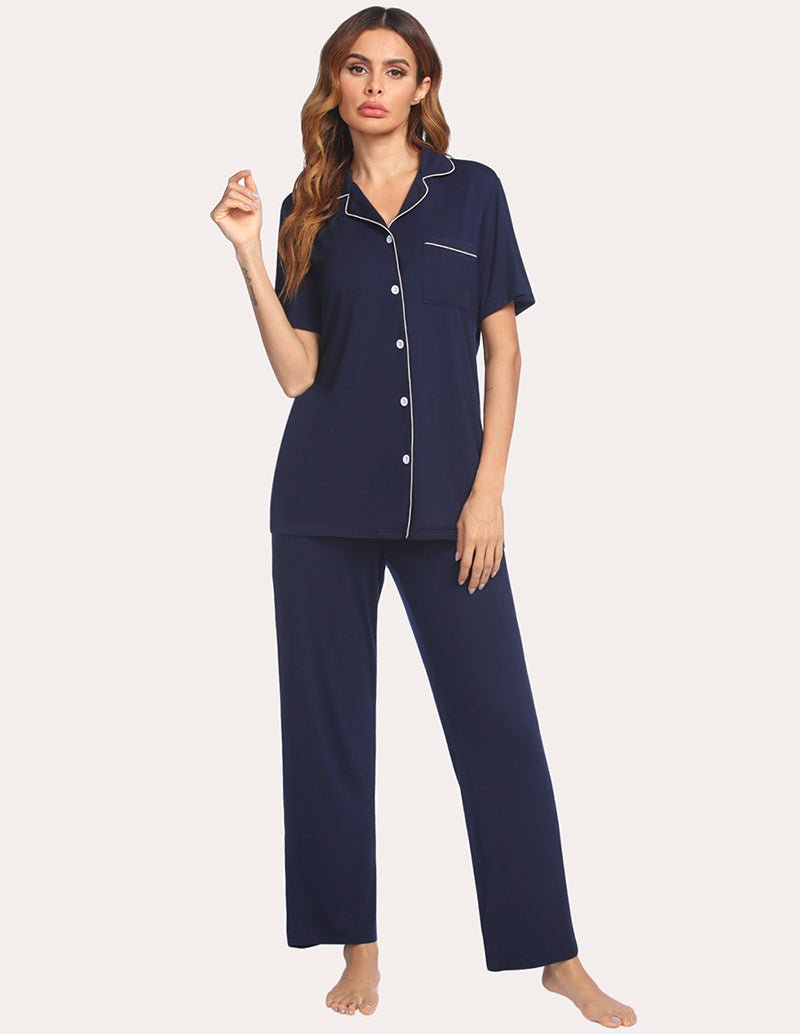 Navy short-sleeve pajama shirt and long pants with white piping and buttons