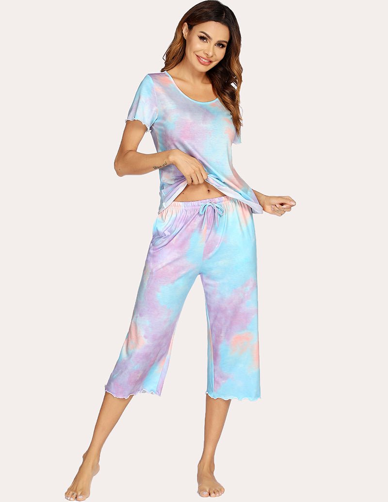 Tie-dye pajama set with short-sleeve top and cropped wide-leg pants, relaxed fit.