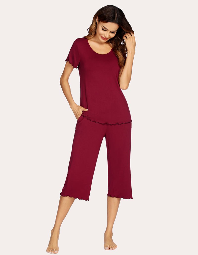 Wine red pajama set with short-sleeve top and cropped wide-leg pants, angled front.