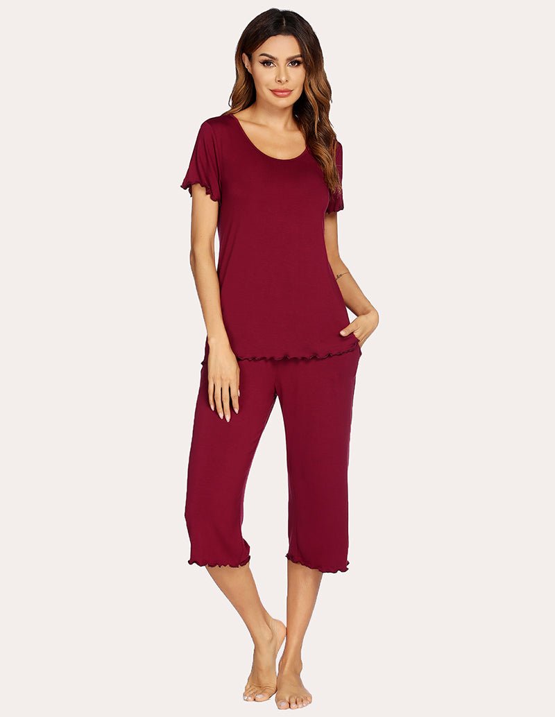 Wine red pajama set with short-sleeve top and cropped wide-leg pants, relaxed fit.