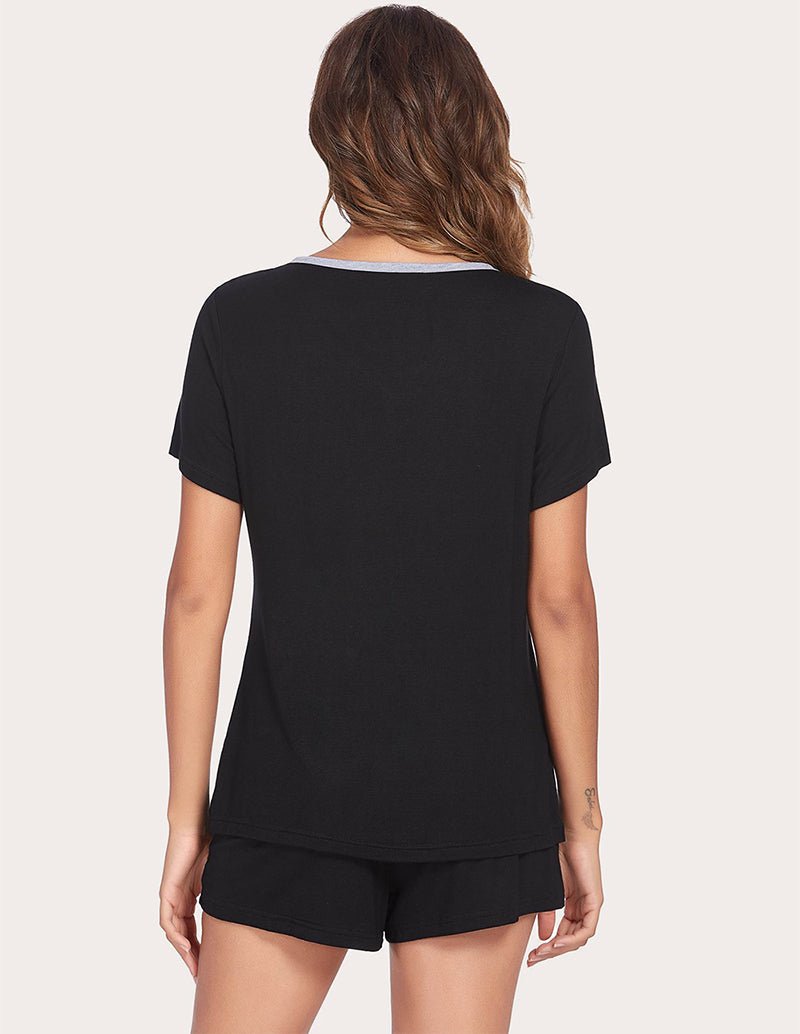 Black V-neck pajama top and drawstring shorts, shown from the back