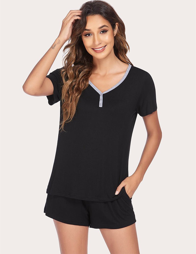 Black pajama set with V-neck top and contrast trim; drawstring shorts set