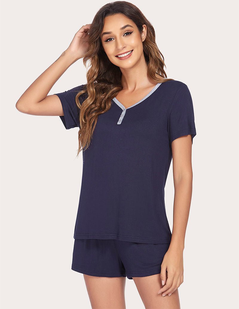 Navy blue pajama set with V-neck top and contrast trim; drawstring shorts