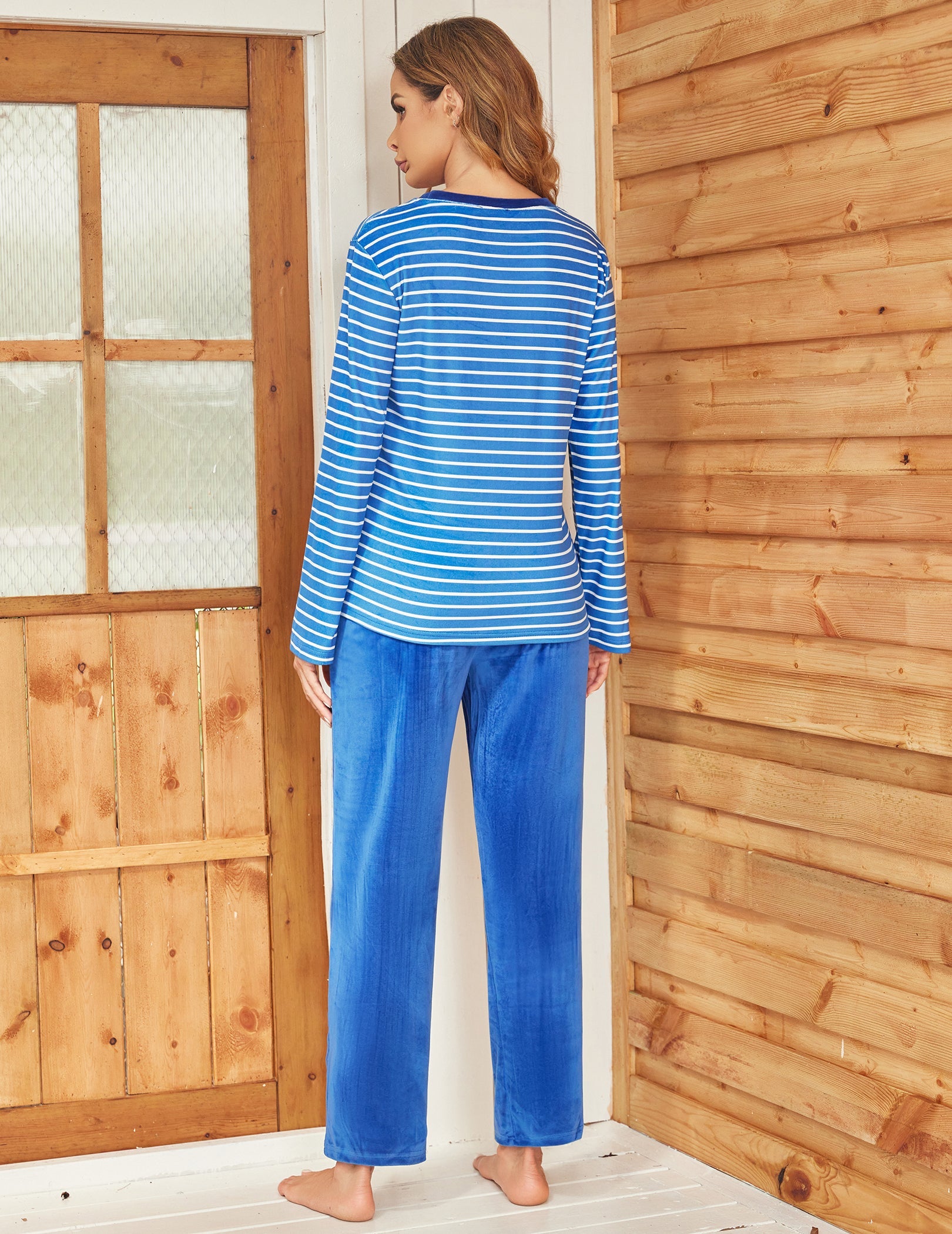 Ekouaer velour pajama set, view from back: blue-and-white striped top and blue pants