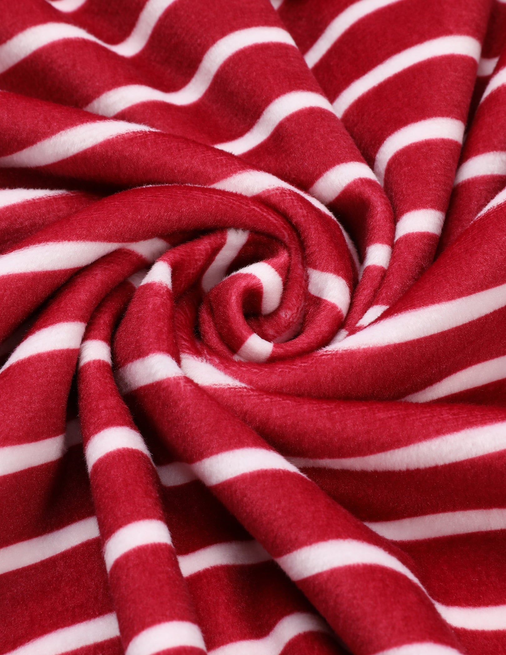 Velour fabric close-up in red with white horizontal stripes, swirl texture
