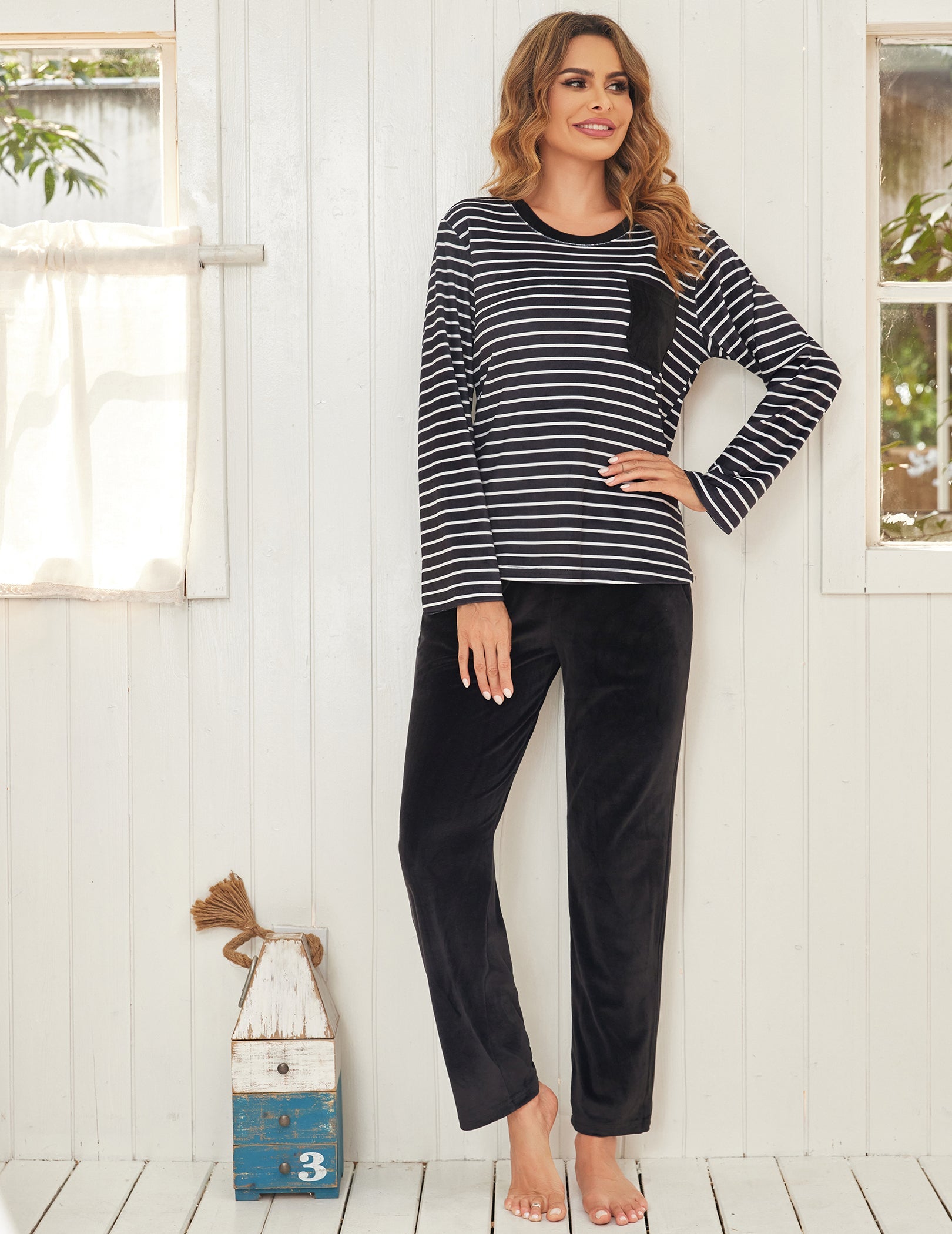 Black and white striped velour pajama top with long sleeves and relaxed pants