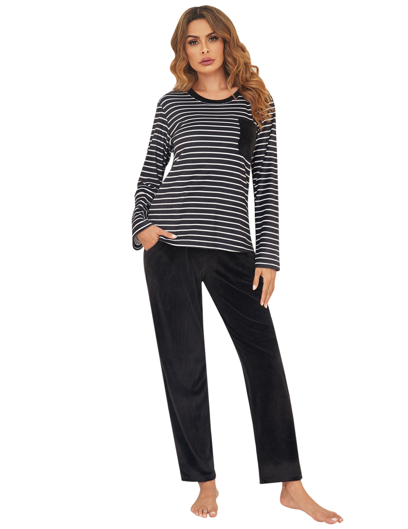 Velour pajama set with black-and-white striped long-sleeve top and dark pants, full body