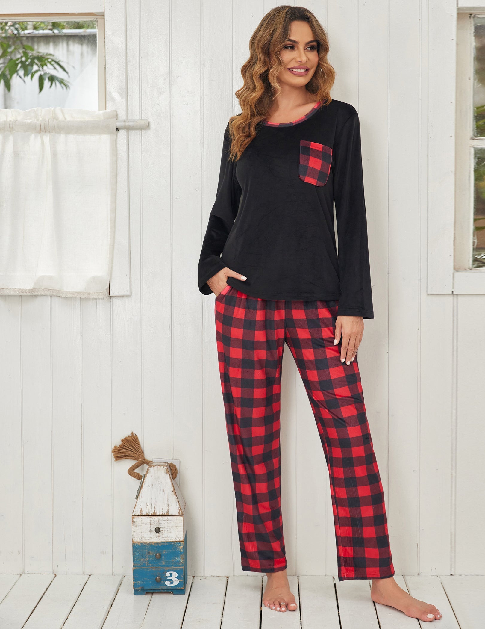 Black velour pajama set with red plaid pants and chest pocket