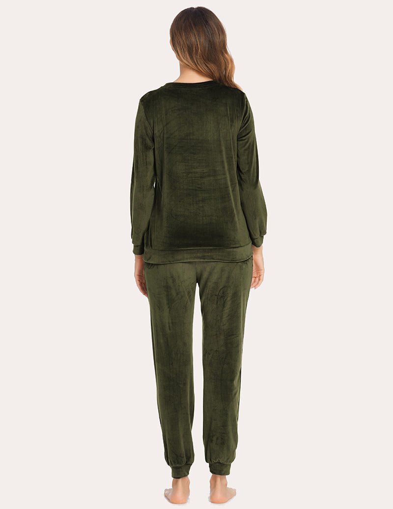 Back view: velour tracksuit set in dark green, long-sleeve top and matching joggers