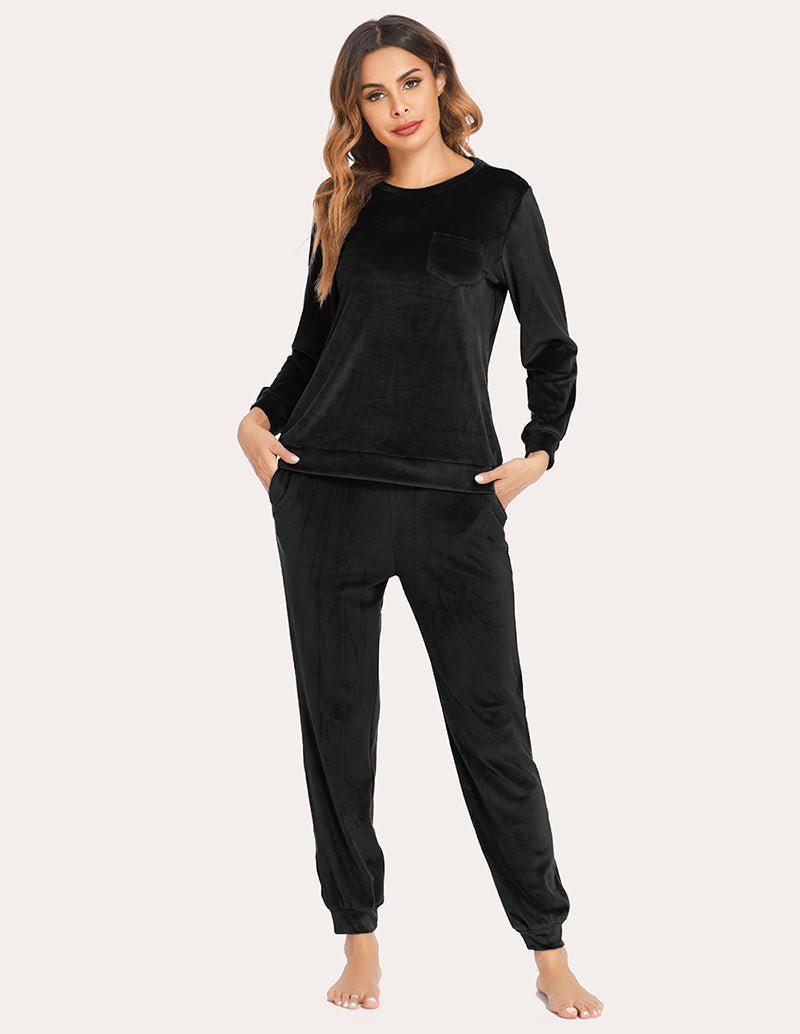 Velour tracksuit set in black, long-sleeve top with chest pocket and tapered joggers