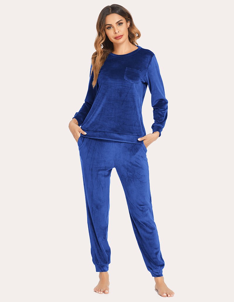 Blue velour tracksuit set: crewneck top with pocket and drawstring jogger pants.