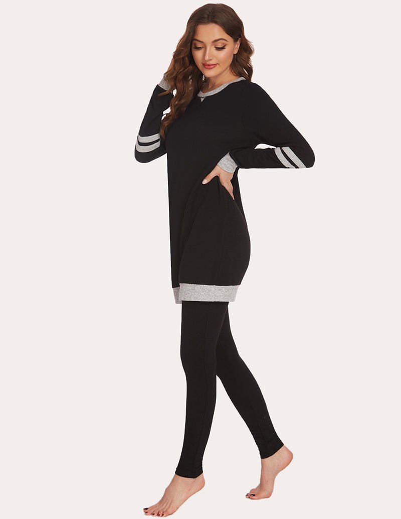Black long-sleeve pajama tunic top with striped cuffs and matching leggings, side view