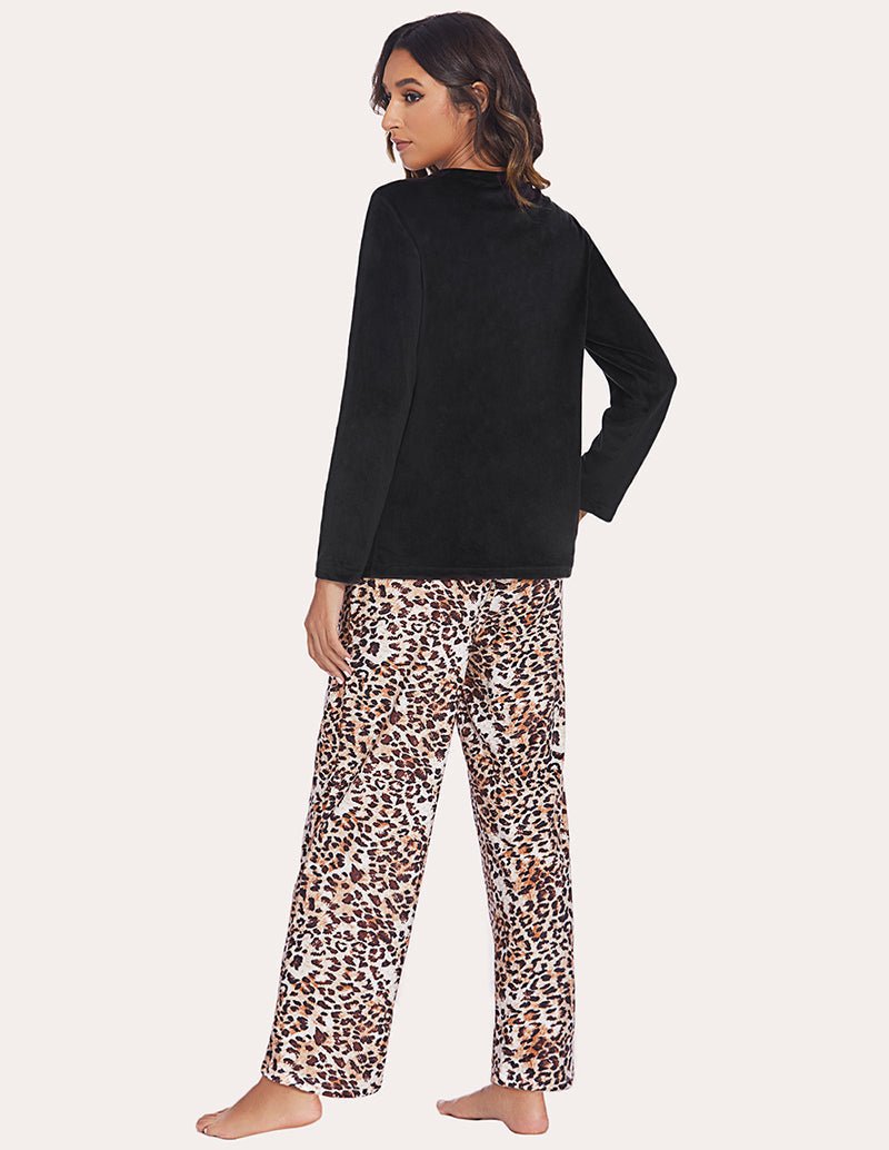 Women's pajama set with solid black long-sleeve top and leopard-print wide pants