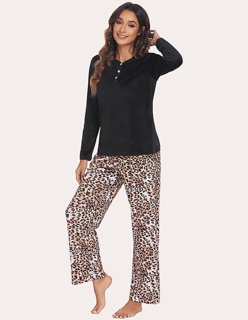 Women's pajama set with solid black henley top and leopard-print pajama pants