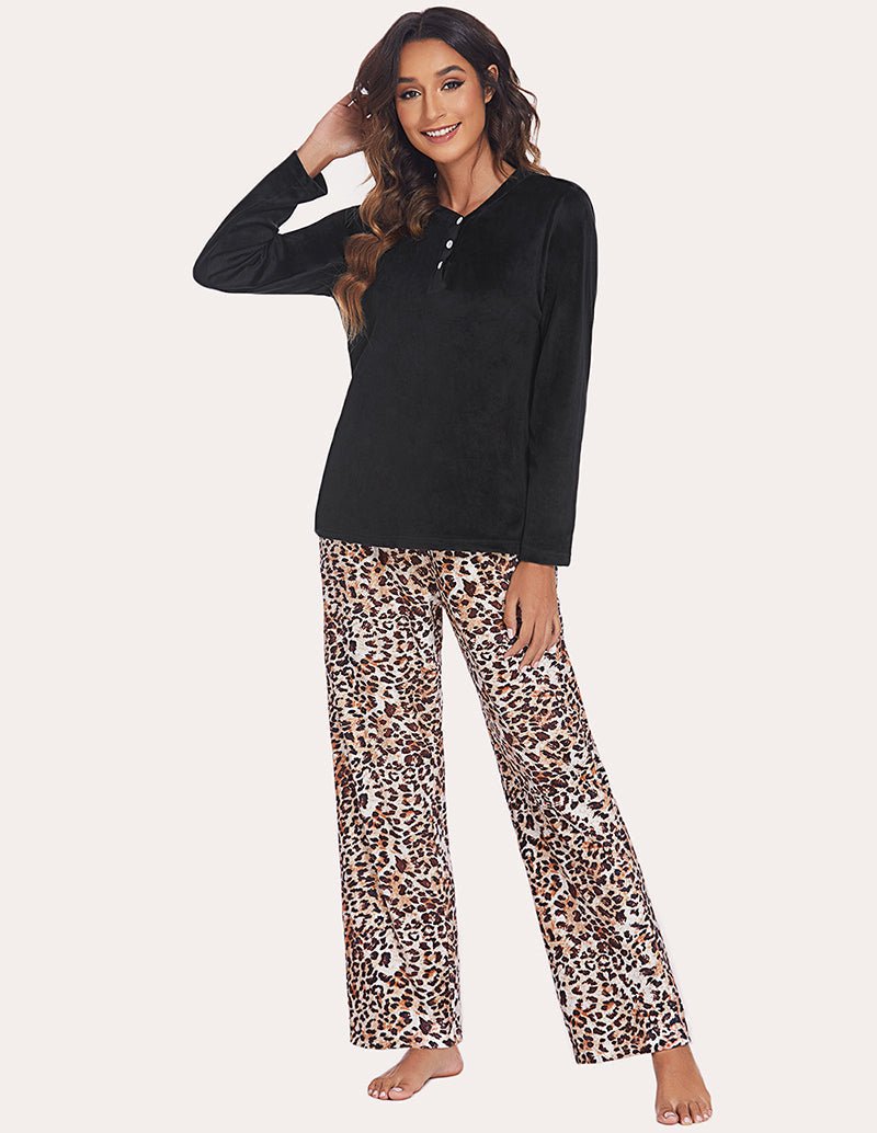 Women's pajama set with solid black henley top and leopard-print flared pajama pants