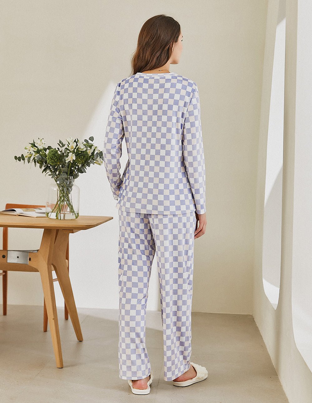 Back view of women’s checkered pajama set: long-sleeve henley top and matching pants