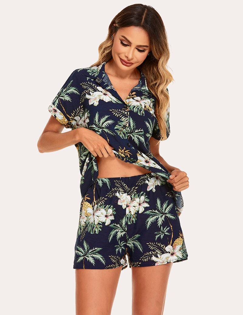 Woven short sleeve pajama set, dark navy tropical floral leaf print, close-up