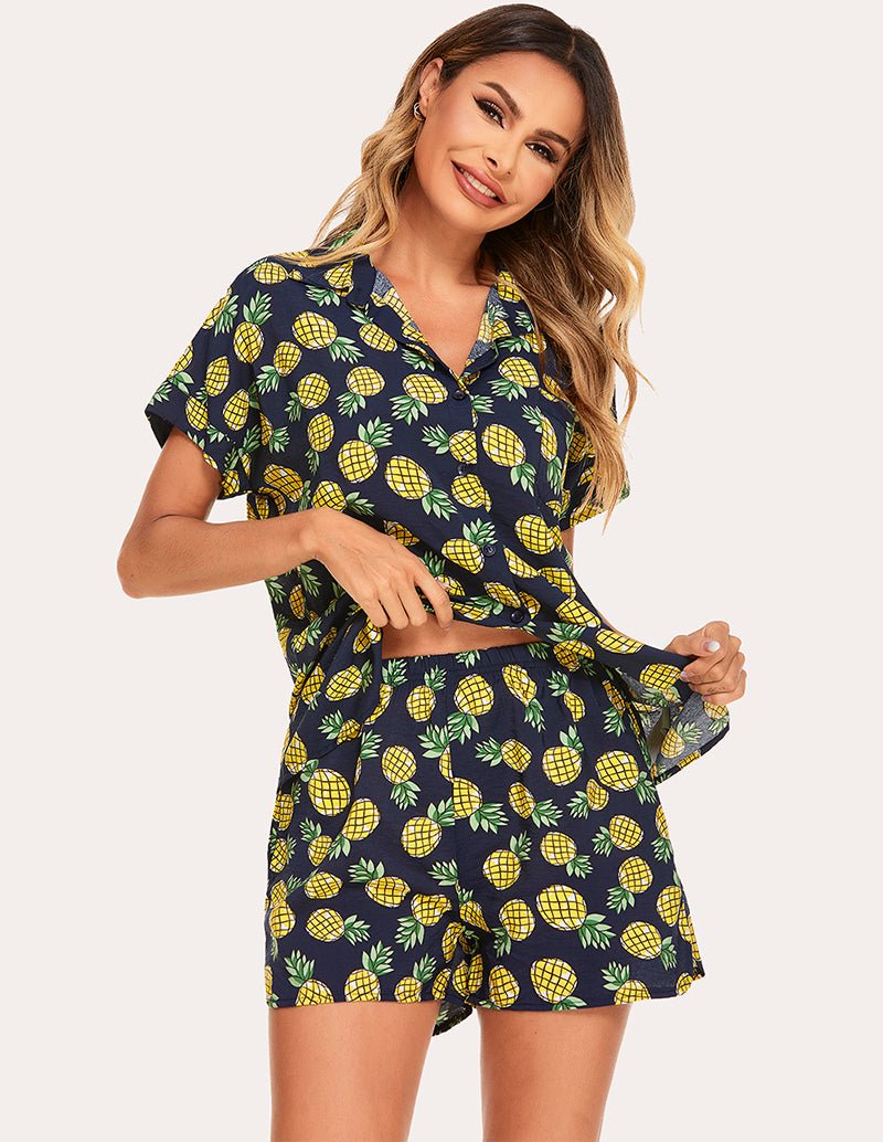 Woven short-sleeve pajama set in navy with lemon print, side view showing top and shorts set