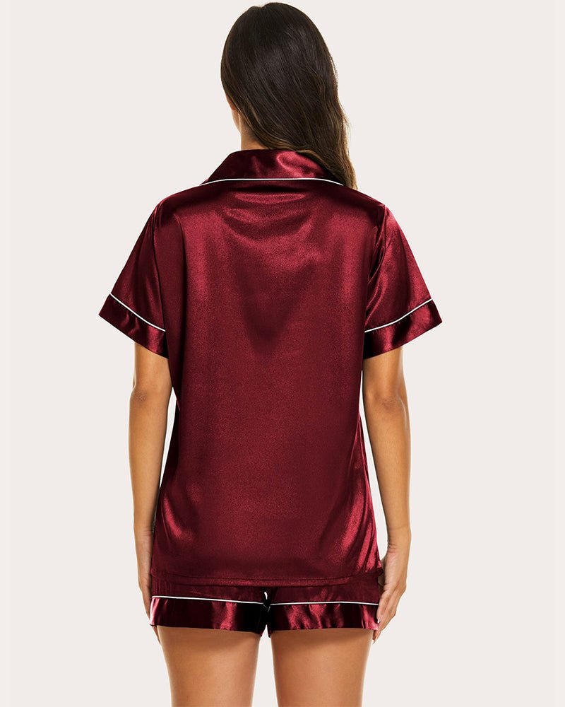 Back view of burgundy satin short-sleeve pajama set with matching shorts and trim