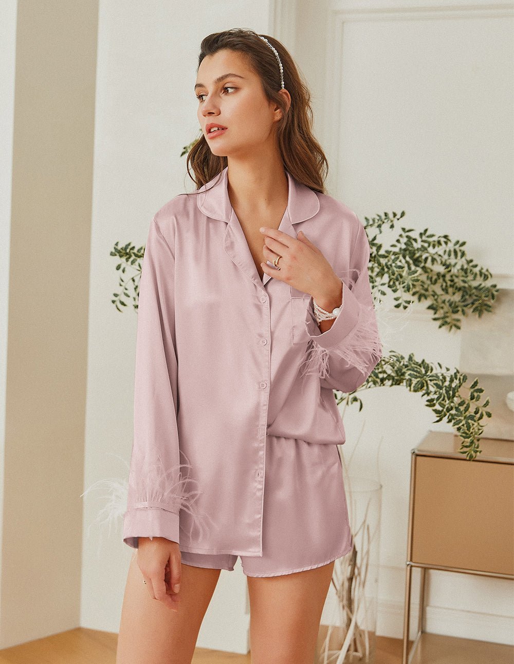 Feather-trim satin pajama set in light pink, button-up shirt with feather cuffs and shorts