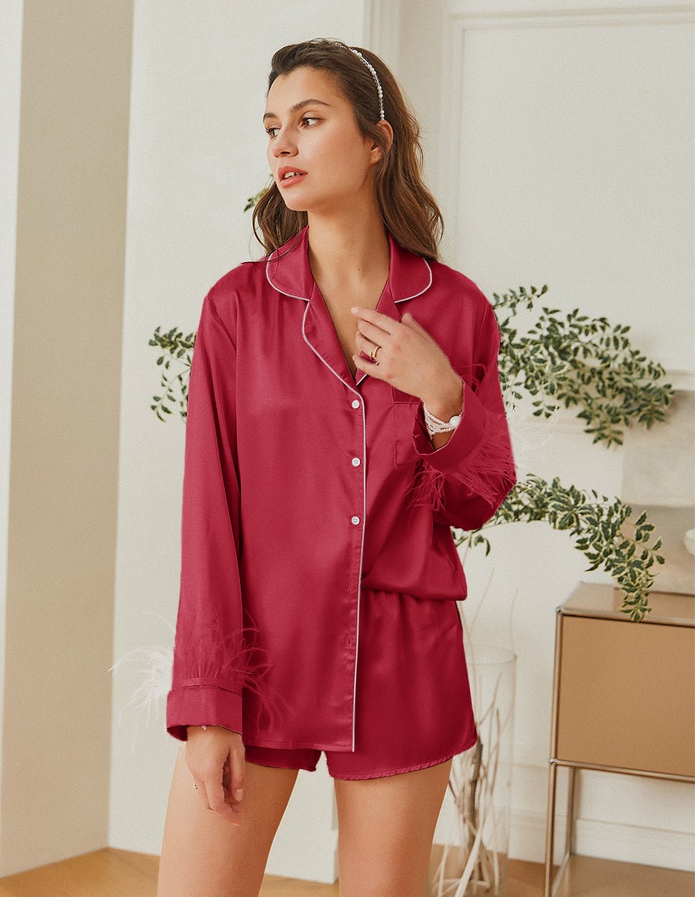 Feather-trim satin pajama set in deep pink, button-up shirt with feather cuffs and shorts